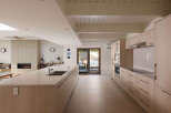This modern kitchen boasts a sleek design with ample counter space and stylish cabinetry.