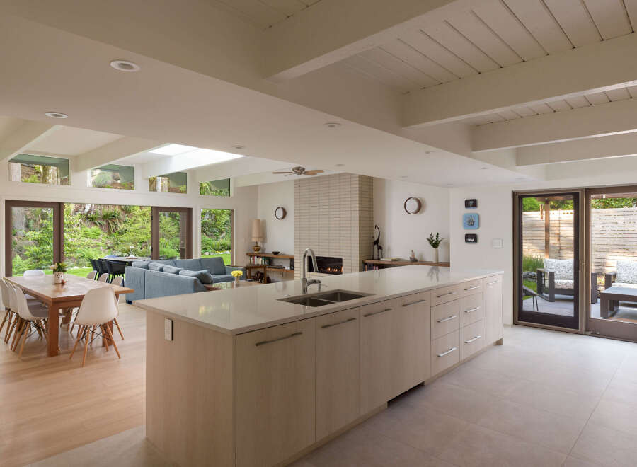 This stunning modern kitchen boasts a spacious layout with a large island, perfect for entertaining.