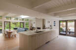 This stunning modern kitchen boasts a spacious layout with a large island, perfect for entertaining.