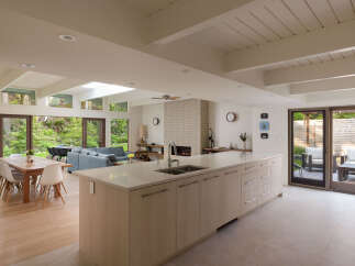 This stunning modern kitchen boasts a spacious layout with a large island, perfect for entertaining.