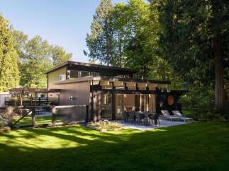 This stunning modern home offers a seamless blend of indoor and outdoor living.