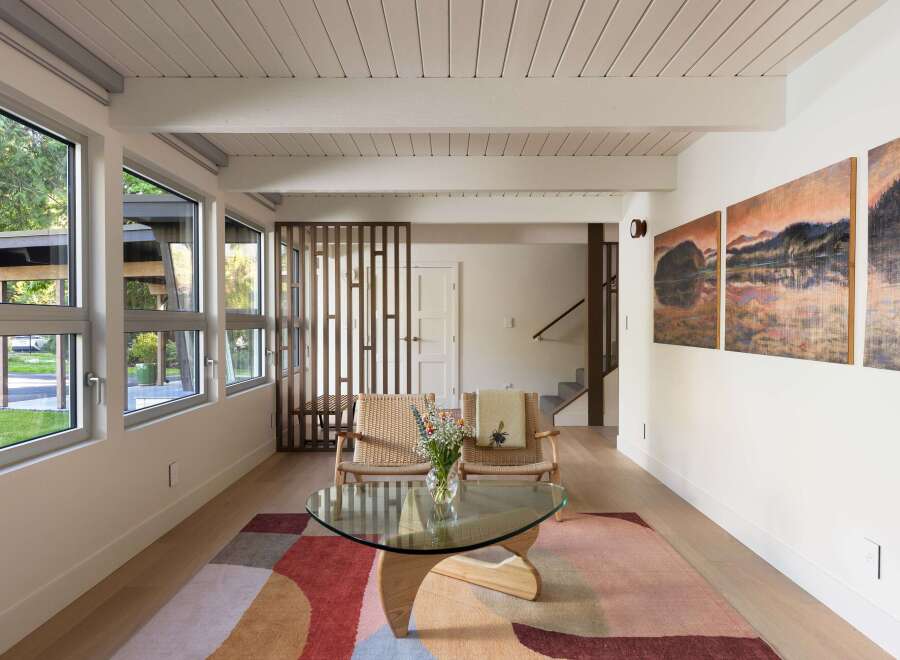 This stunning living space boasts a modern design with a touch of nature.