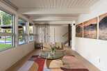 This stunning living space boasts a modern design with a touch of nature.