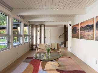This stunning living space boasts a modern design with a touch of nature.