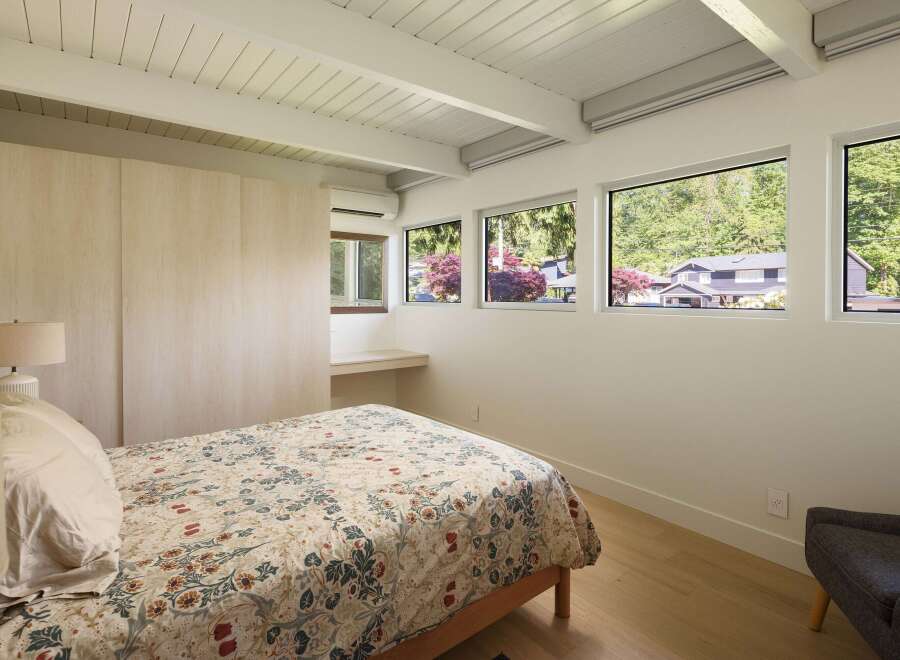 This stunning bedroom boasts a modern design with clean lines and ample natural light.
