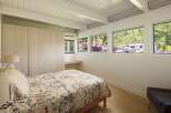 This stunning bedroom boasts a modern design with clean lines and ample natural light.