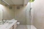 This modern bathroom boasts a sleek design with neutral tones and high-end finishes.
