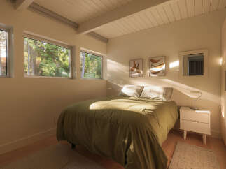 This serene bedroom offers a tranquil retreat with its minimalist design and natural light.