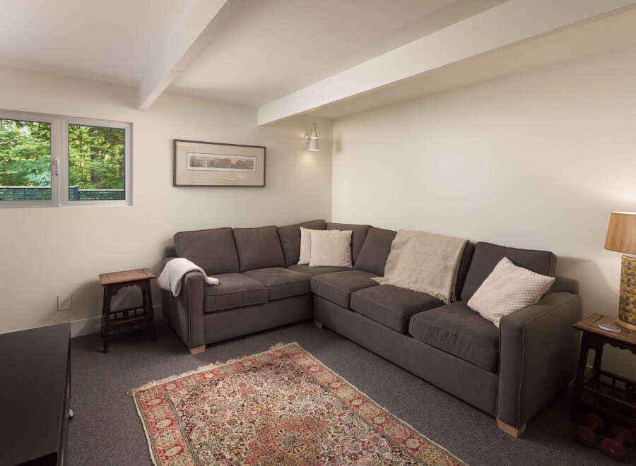 Discover the comfort of this inviting living space, featuring a stylish sectional sofa perfect for relaxation.