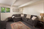 Discover the comfort of this inviting living space, featuring a stylish sectional sofa perfect for relaxation.