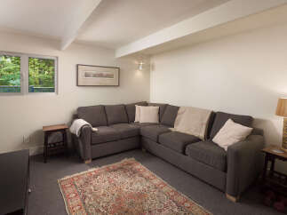 Discover the comfort of this inviting living space, featuring a stylish sectional sofa perfect for relaxation.