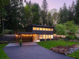 This stunning modern home offers a perfect blend of contemporary design and natural beauty.