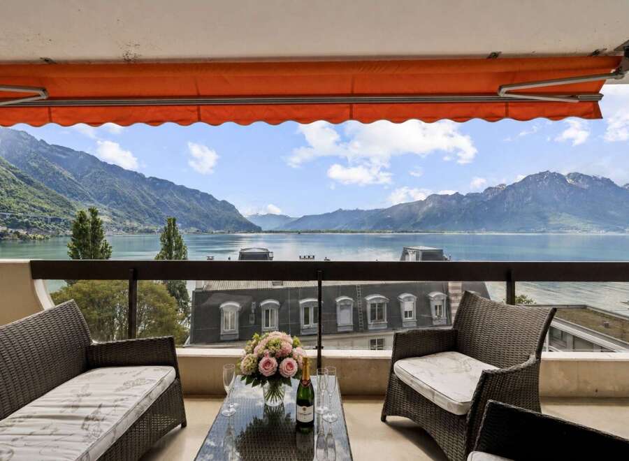 Experience breathtaking panoramic views of the lake and mountains from this stunning balcony, perfect for enjoying your morning coffee or evening wine.