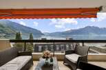 Experience breathtaking panoramic views of the lake and mountains from this stunning balcony, perfect for enjoying your morning coffee or evening wine.