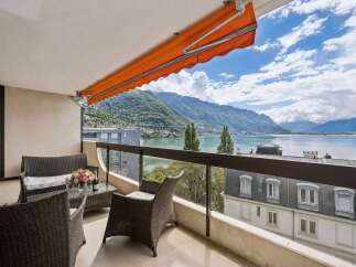Enjoy breathtaking lake and mountain views from this stunning balcony, perfect for relaxing or entertaining.