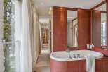 Indulge in luxury within this exquisite bathroom, featuring a stunning bathtub and elegant design.
