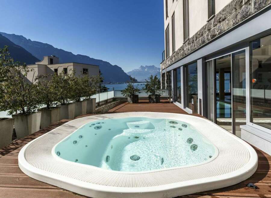 Enjoy breathtaking views from this luxurious property featuring a private hot tub.