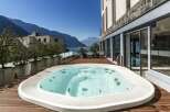 Enjoy breathtaking views from this luxurious property featuring a private hot tub.
