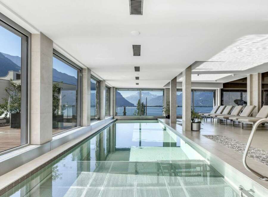 Experience luxury living with this stunning indoor pool, offering breathtaking mountain and lake views.