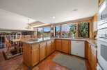 This stunning kitchen boasts a warm and inviting atmosphere, perfect for culinary creations and gatherings.