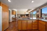 Step into this inviting kitchen, featuring a spacious island with a cooktop, perfect for culinary creations.