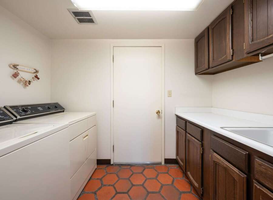 This laundry room features a classic design with a focus on functionality.
