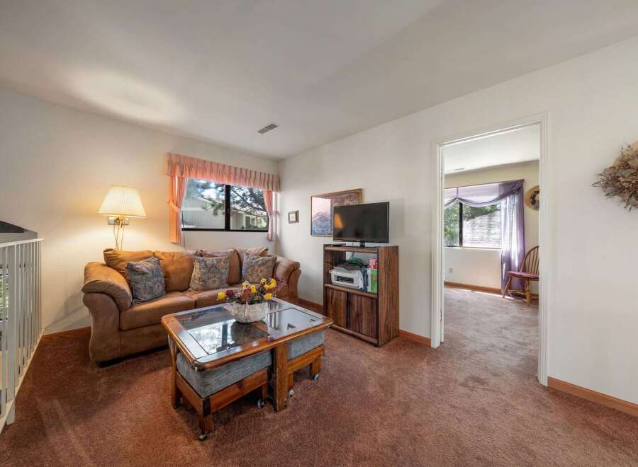 Step into this inviting living space, perfect for relaxation and entertaining.