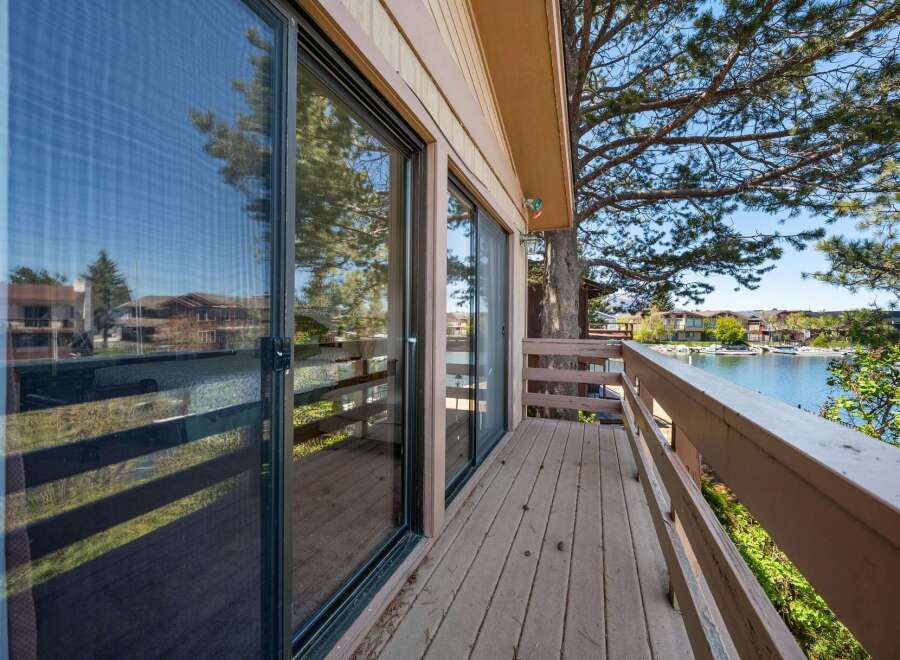 Enjoy stunning lake views from this beautiful property! This home features a spacious deck, perfect for relaxing and entertaining.