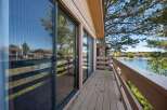 Enjoy stunning lake views from this beautiful property! This home features a spacious deck, perfect for relaxing and entertaining.