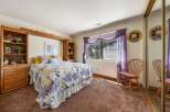 This charming bedroom offers a cozy retreat with its inviting ambiance and thoughtful design.