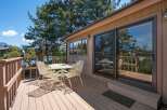 Enjoy breathtaking views from this stunning lakeside property! This home features a spacious deck perfect for entertaining or relaxing.