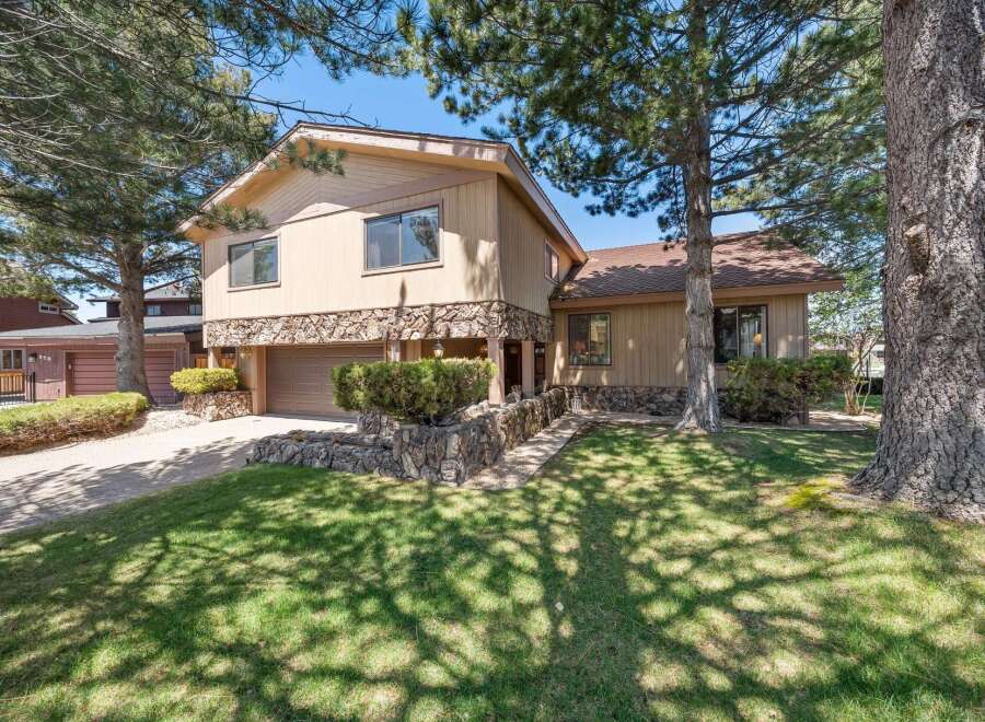 This stunning property boasts a beautiful exterior with a combination of stone and siding, creating a unique and inviting curb appeal.