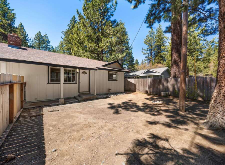 Discover the charm of this inviting property, featuring a cozy exterior and a well-maintained yard.