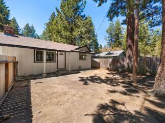 Discover the charm of this inviting property, featuring a cozy exterior and a well-maintained yard.