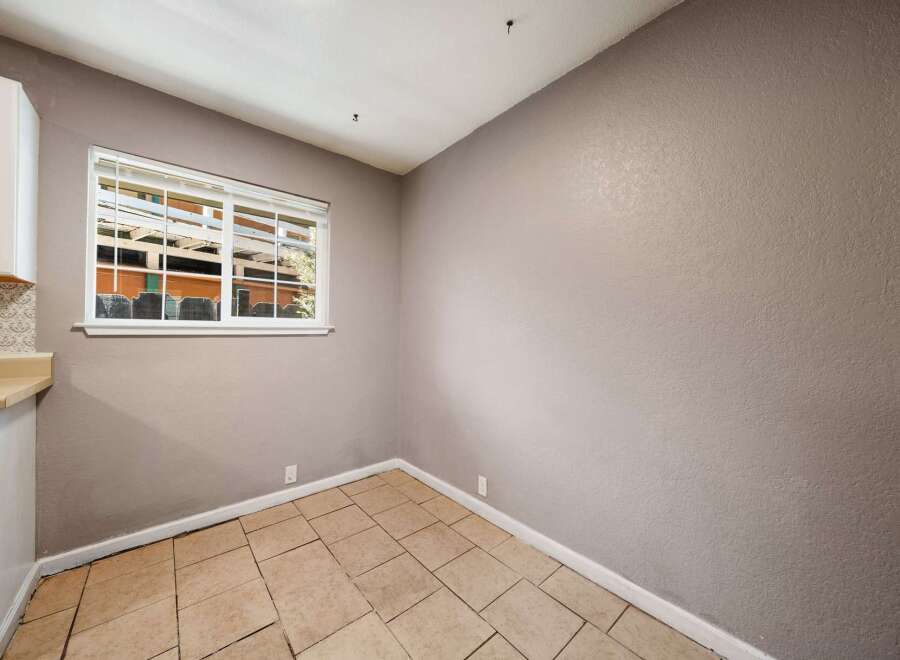 This inviting space features a bright window that allows natural light to flood the room.