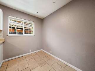 This inviting space features a bright window that allows natural light to flood the room.