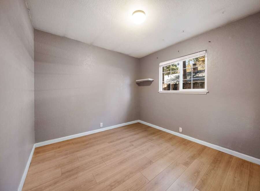 This inviting room features beautiful hardwood floors and neutral walls, creating a versatile space ready for your personal touch.