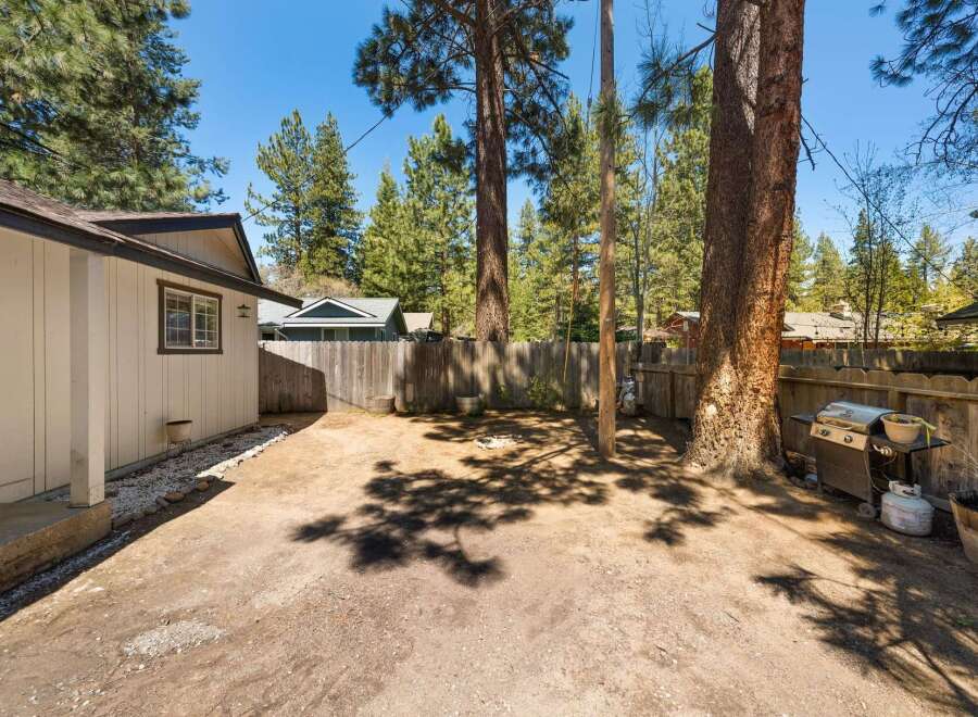 Discover the potential of this charming property! This backyard features a spacious area, perfect for outdoor gatherings and relaxation.