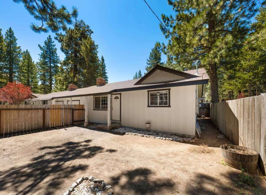 This charming property boasts a cozy exterior with a welcoming entrance.