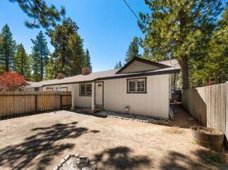 This charming property boasts a cozy exterior with a welcoming entrance.