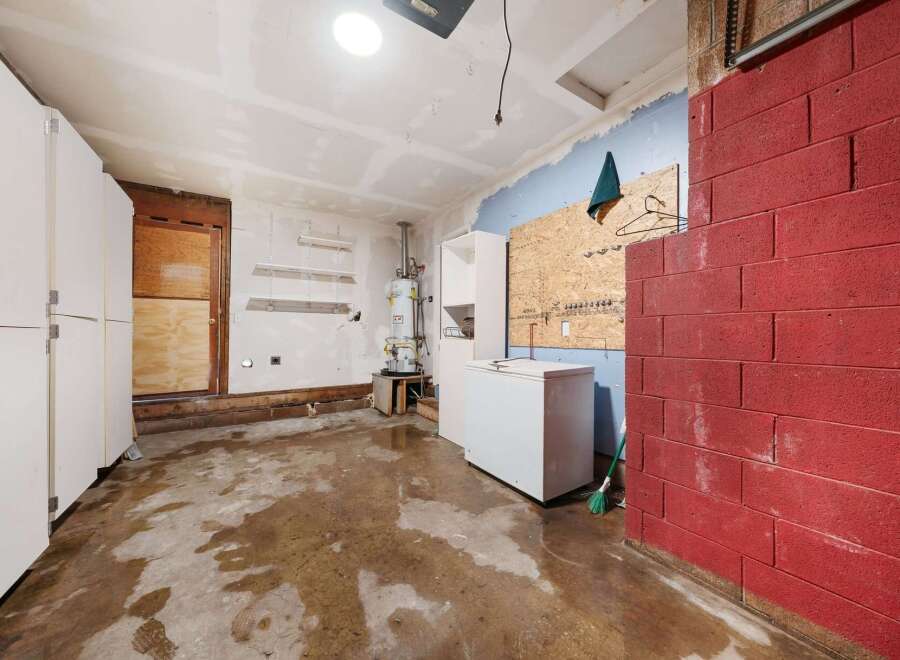 Explore the potential of this unfinished garage, perfect for customization.