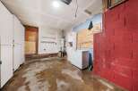 Explore the potential of this unfinished garage, perfect for customization.