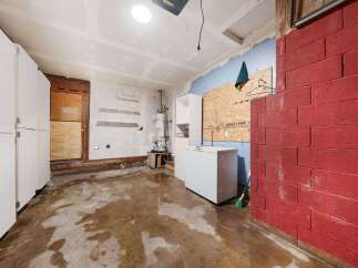 Explore the potential of this unfinished garage, perfect for customization.