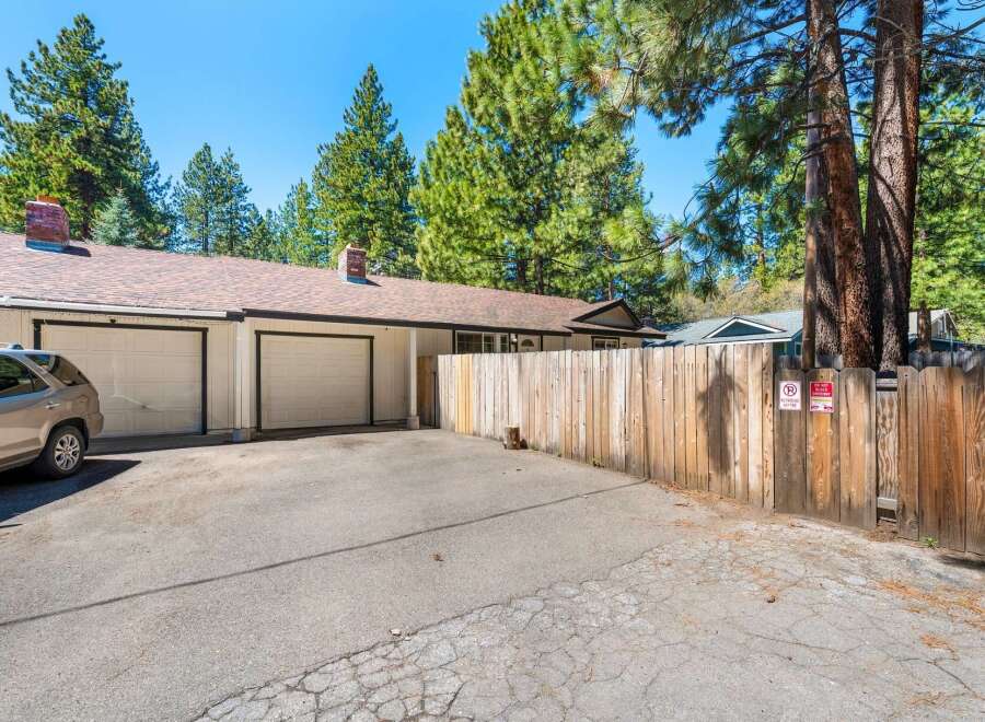 Discover this charming property featuring a two-car garage and a welcoming driveway.