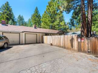 Discover this charming property featuring a two-car garage and a welcoming driveway.