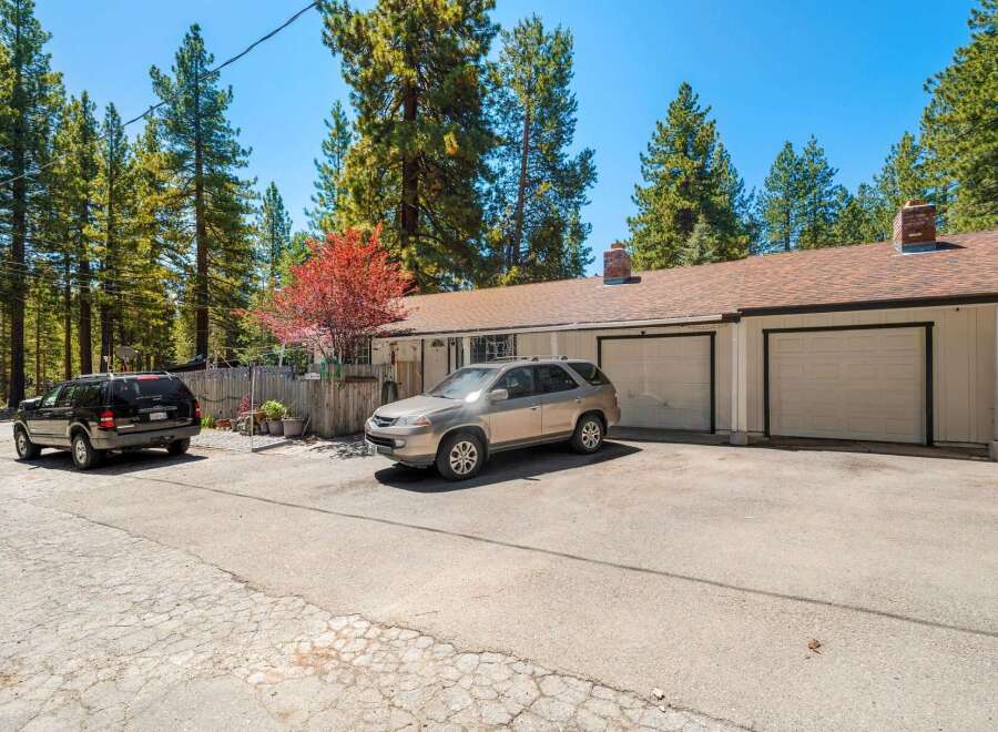 Discover this charming property featuring a spacious driveway and a two-car garage, perfect for parking and storage.