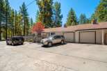 Discover this charming property featuring a spacious driveway and a two-car garage, perfect for parking and storage.