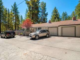 Discover this charming property featuring a spacious driveway and a two-car garage, perfect for parking and storage.