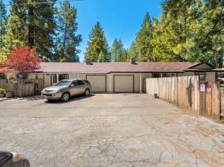 Discover the charm of this inviting property, featuring a well-maintained exterior and a convenient driveway.