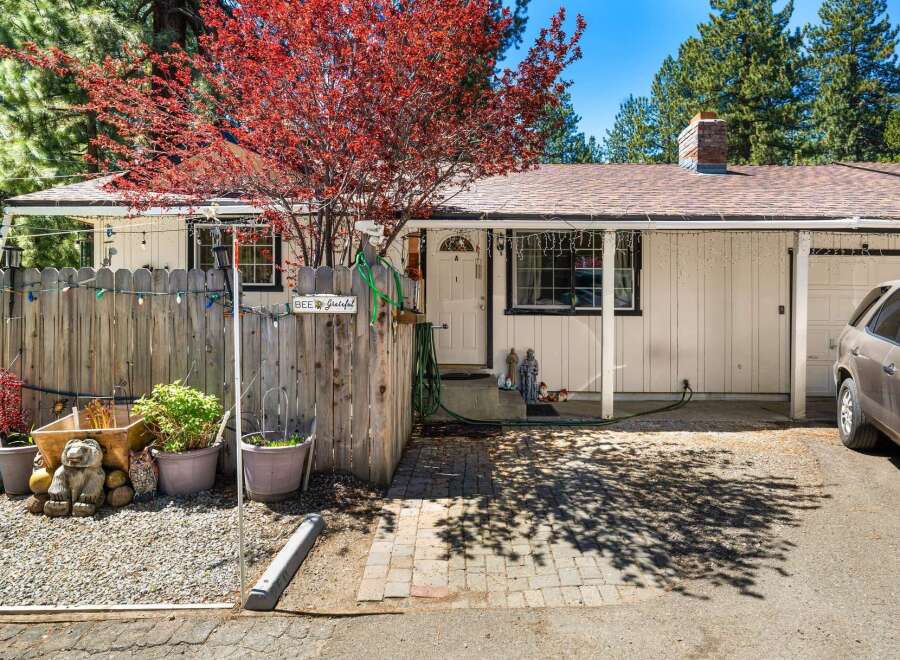 Charming home with a welcoming facade, featuring a well-maintained exterior and a lovely front yard.